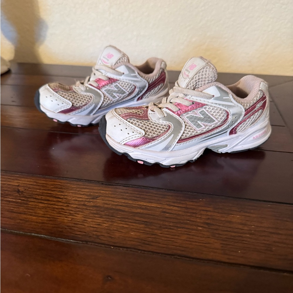 New Balance Kids' pink and white sneakers